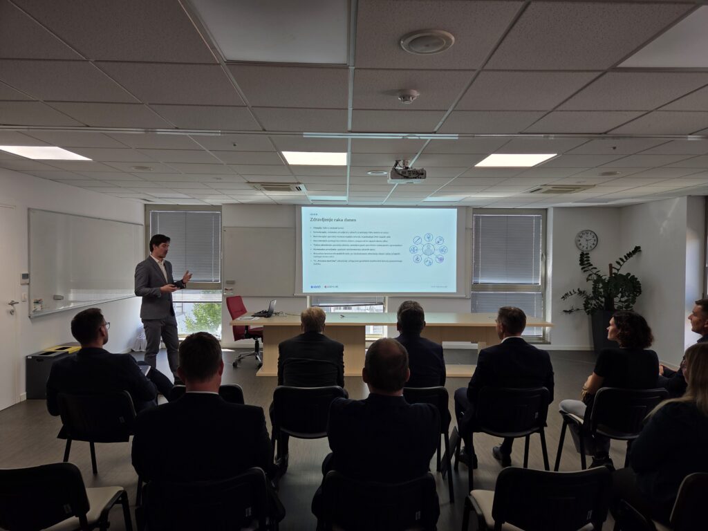 Dr Kristjan Anderle, chief scientific lead on the project, walked the visitors through the core radiotherapy technologies behind AMID.